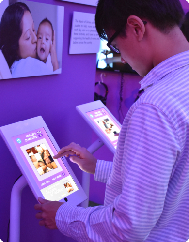 a man interacting with a touchscreen